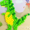 JE CREE MON TABLEAU EN POMPONS DINO 15 X 21 CM